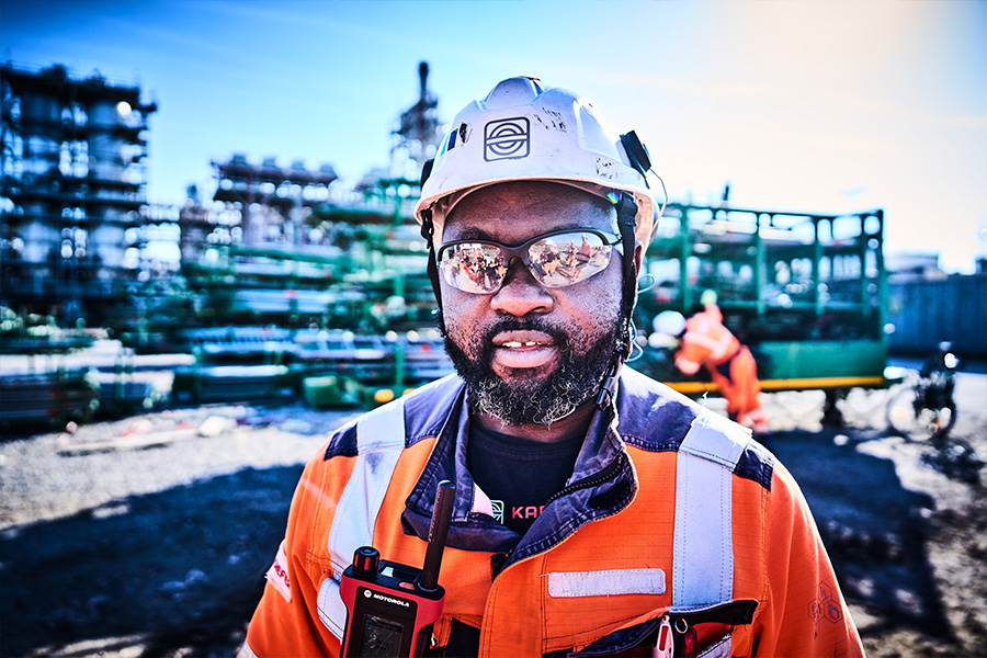 KAEFER operative on site in full PPE looking at the camera